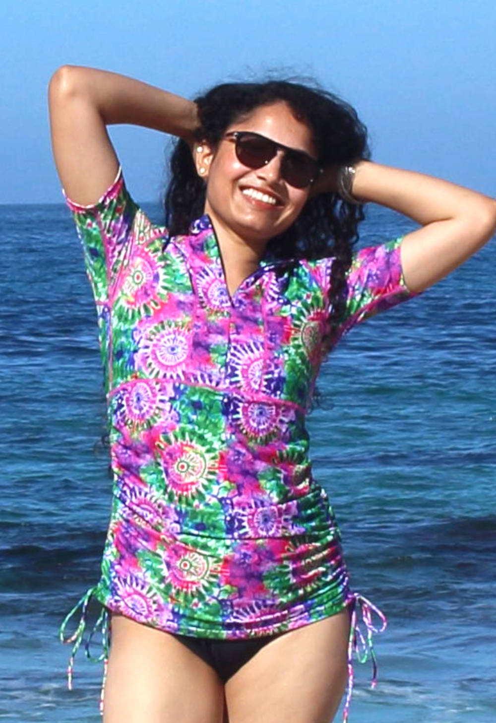 http://oceanroadswimwear.com.au/wp-content/uploads/2017/01/womens-short-sleeve-adjustable-length-swim-shirt-with-floral-pink-design.jpg