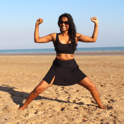 woman wearing swim skirt and cami top on beach two piece swimsuit bikinin