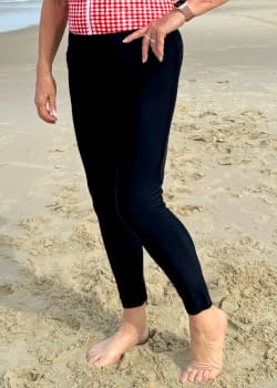 Sonia plus size long swim pants in black worn as layered swimwear