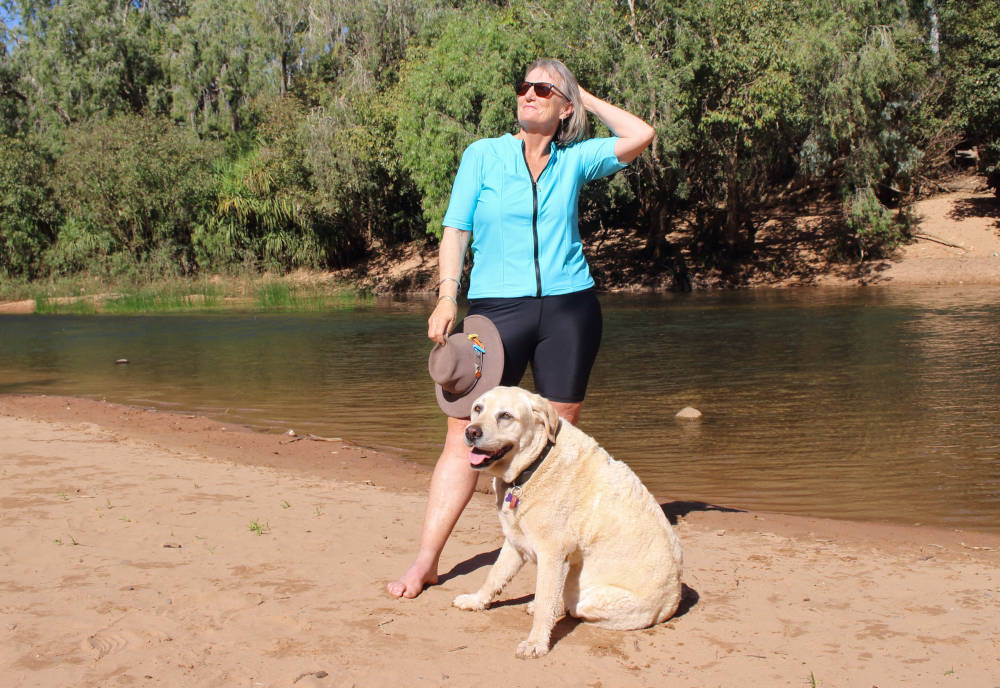 woman and dog katherine river katherine nt australia wearing ocean road swimwear BANNER