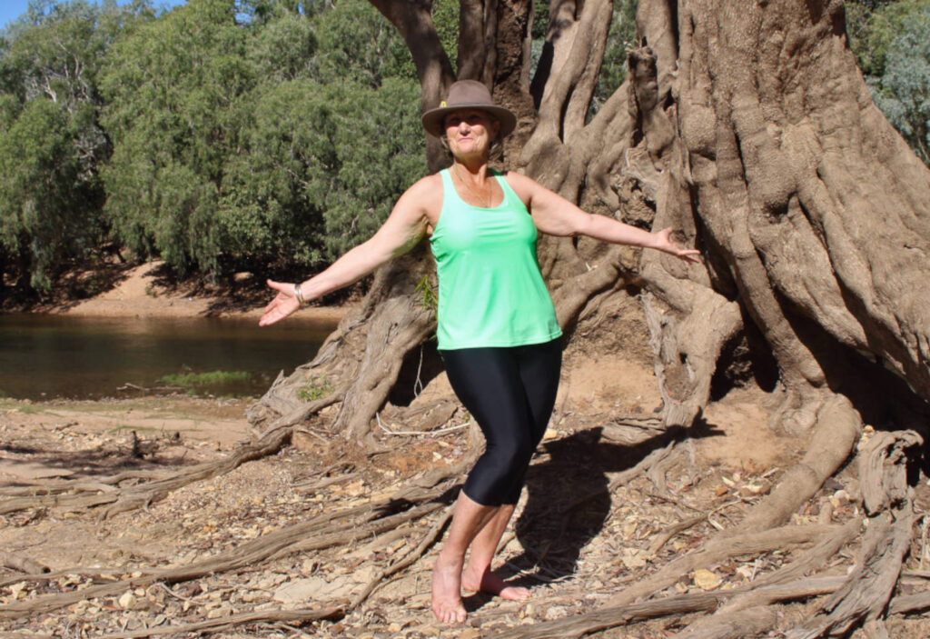 woman wearing swim leggings capri pants and race back tankini