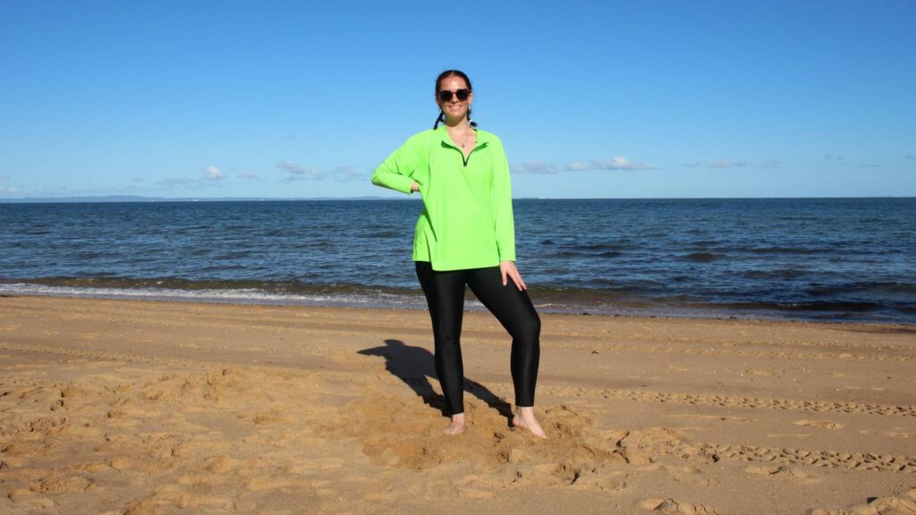 women wearing lime rashie baggy and long sun safe swim geggings for a beach walk ban_1139