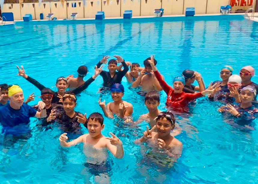 Mair from Global Water Safety Drowning Prevention Rotary Club teaching children how to swim OceanRoad Swimwear Donations being used over the world